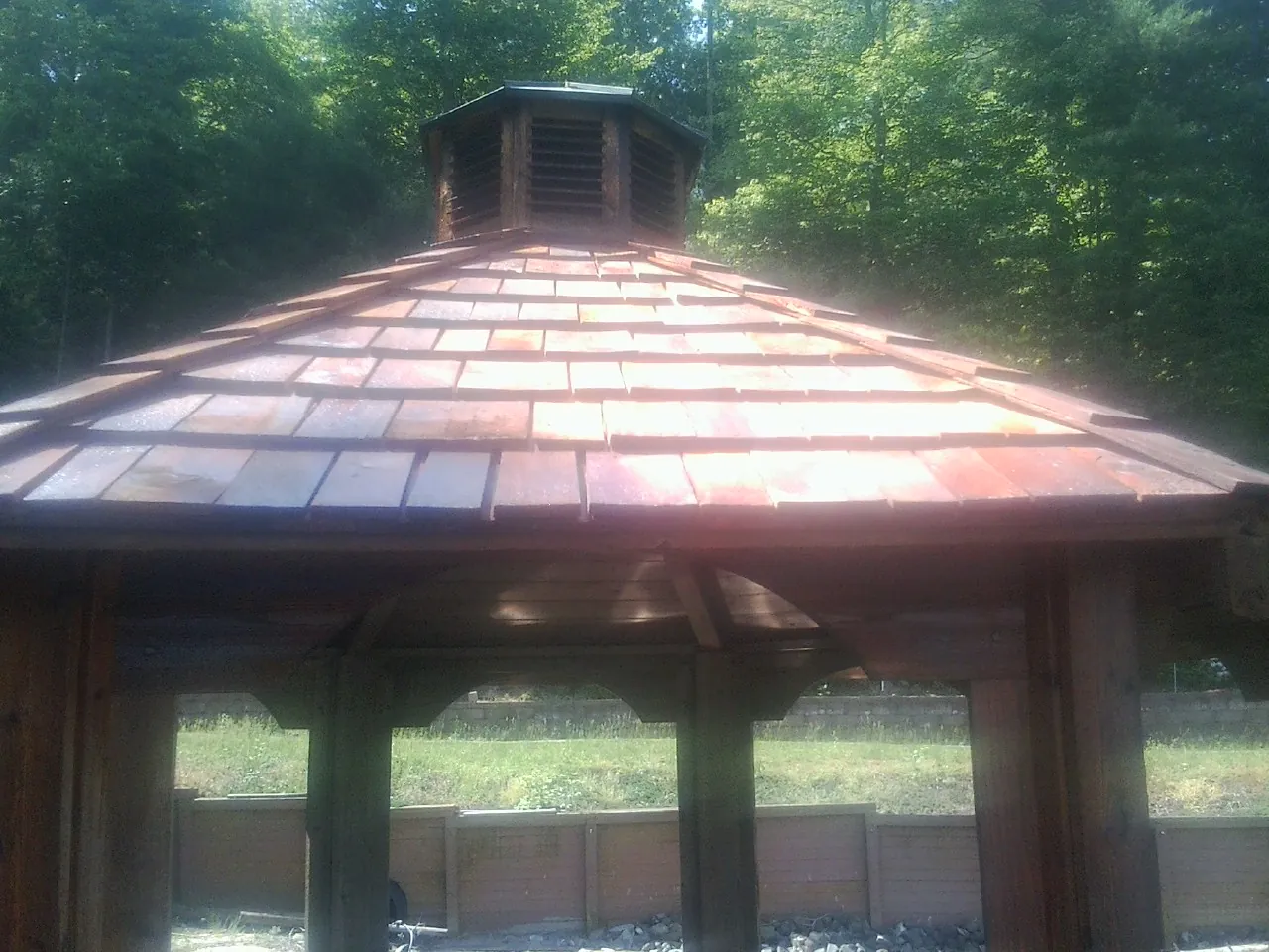 New cedar shake roof and cupola on a lakeside gazebo in Smoaks